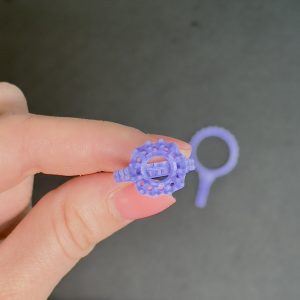 3D-printed wax prototype of the custom ring to check size, shape, and details.