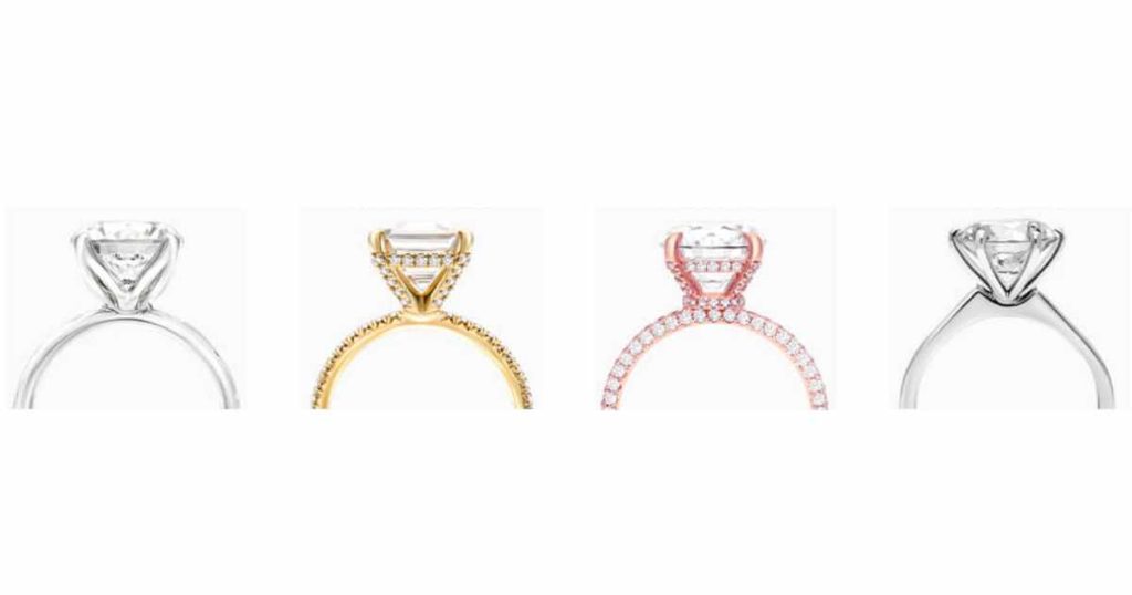 Four engagement rings in different metal types — white gold, yellow gold, rose gold, and platinum — each with a center diamond.